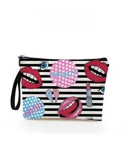 Detail of striped makeup bag featuring colorful pop art lip and eye prints with zipper