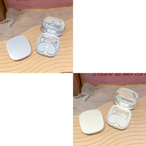 Detail of portable contact lens case showing mirror, storage box, tweezers, and suction tool