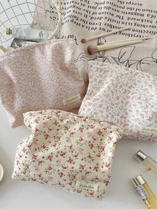 Three-piece floral cotton makeup bags in assorted patterns with minimalist aesthetic