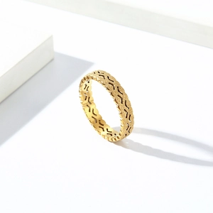 Elegant gold stainless steel ring with pearl sand texture and hollow patterns on white background