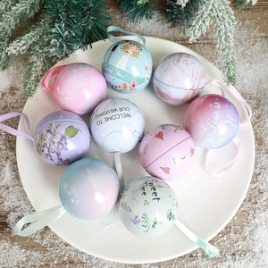 Wedding candy tin balls with silk ribbons and floral patterns for festive party favors