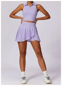 Detail view of lavender tennis set featuring a sleeveless polo top and pleated mini skirt
