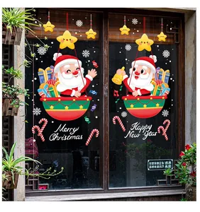 Dettagli di adesivi natalizi con Babbo Natale in mongolfiera e stelle decorative