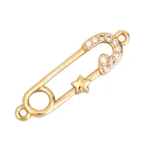 Detailed view of 27mm gold plated safety pin connector with white zircon and star inlay