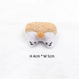 Close-up of cute plush corgi brooch featuring detailed embroidery, size 4cm by 5cm
