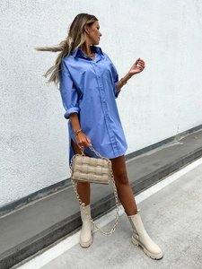 Detail of royal blue oversized shirt dress with buttons and pointed collar