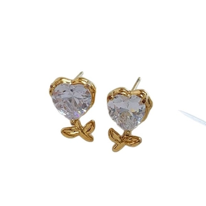 Elegant heart-shaped cubic zirconia earrings with gold leaf accents on a clean background