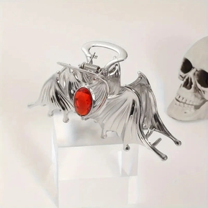 Silver gothic bat hair claw clip with a red ruby gem accent for Halloween styling