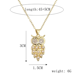 Detailed dimensions of gold owl pendant necklace featuring white faux pearl and rhinestones