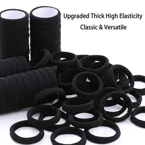 Set of thick black seamless high-elastic hair ties shown stacked on a white background
