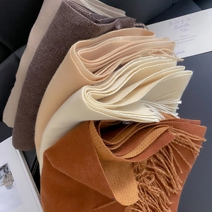 Elegant thick cashmere-like scarves with fringe in brown, beige and white colors