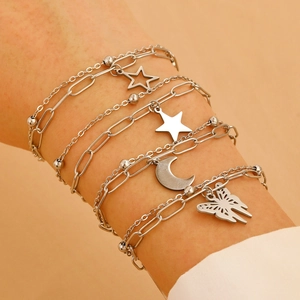 Silver layered bracelet featuring star, moon and butterfly charms on a bead and clip chain