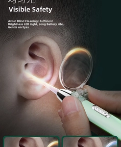 Macro detail of LED earwax removal tool with magnifying glass and mint green handle