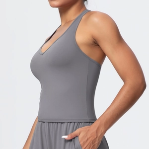 Detail of dark grey yoga top showing seamless edge stitching and brushed fabric texture