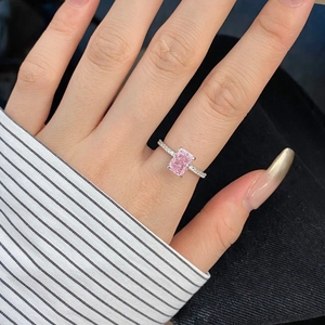 Macro shot of S925 sterling silver ring with radiant cut pink zircon on a hand