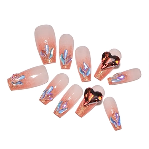 Long coffin gradient press-on nails with shimmering glitter and sparkling rhinestone accents