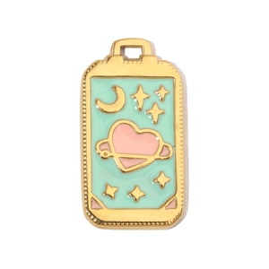 Macro shot of mint green enamel moon and star heart pendant with gold frame