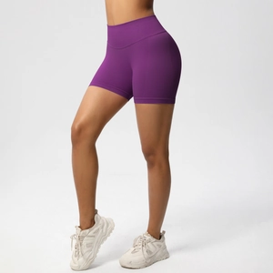 Close-up of seamless dark purple gym shorts with high waist and peach lift effect