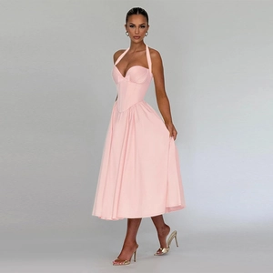 Pink halter neck A-line dress with corset waist and elegant flowing long skirt