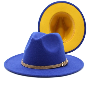 Detail of wool fedora with blue exterior, yellow lining, and brown leather band