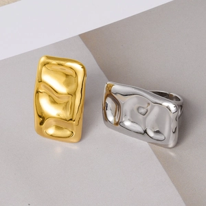 Detailed view of rectangle hammered texture rings in gold and silver finish