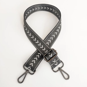 Adjustable dark grey nylon strap with white arrow pattern and black metal swivel hooks