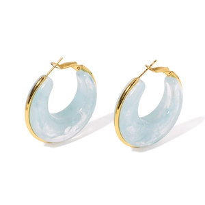 Modern light blue resin C-shape hoop earrings with elegant gold-plated metal borders