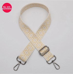 Detail of bohemian geometric pattern shoulder strap with gunmetal swivel hooks