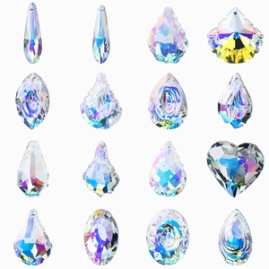 Various AB coated crystal pendants in multiple shapes like heart and teardrop on white base