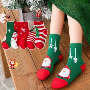 4 pairs of Christmas cotton socks for kids featuring Santa, snowman, and reindeer motifs