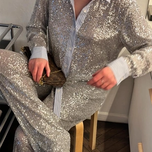 Women's vintage loose silver sequin shirt and shorts set with light blue striped cuffs