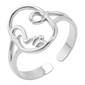 Macro shot of silver minimalist open ring featuring an abstract artistic face outline