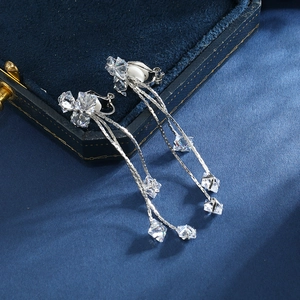 Silver long tassel clip-on earrings with square zircon on navy velvet jewelry box
