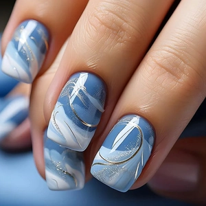 Short square press-on nails with blue-white marble texture and gold metallic lines