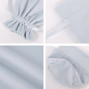 Detailed views of light blue velvet drawstring bag showing fabric texture and round base
