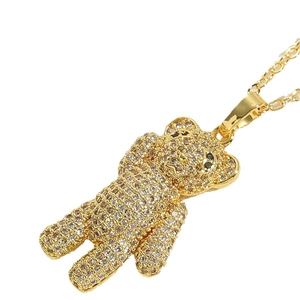 Golden bear pendant necklace with sparkling cubic zirconia on a delicate gold chain