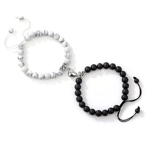 Detail of magnetic heart clasp connecting natural stone bracelets for couples