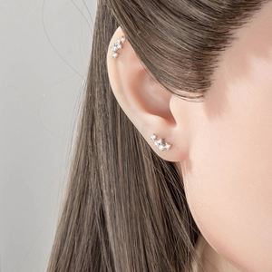 Marquise geometric zircon cartilage stud earring in silver finish on ear cartilage
