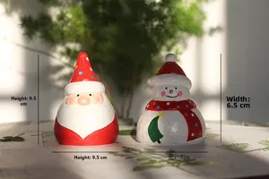 Detail of Santa and Snowman desk ornaments with wood-cut texture and dimensions