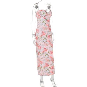 Close-up of pink floral dress with white lace neckline and vibrant rose print details