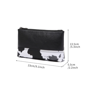 Cow print PU leather shoulder bag dimensions showing 23x13.5x5.5cm for Bohemian style