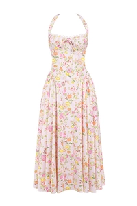 Close-up of pink floral summer maxi dress featuring halter neck ties and high waist detail