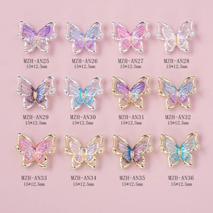 Laser butterfly nail art charms with iridescent wings in various colors for manicure