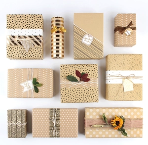 Flat lay of eco-friendly kraft wrapping paper with geometric patterns and gift tags