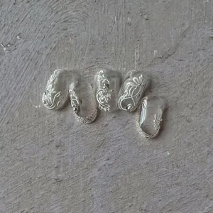 5-piece set of embossed floral nail art stickers with white 3D patterns and silver glitter