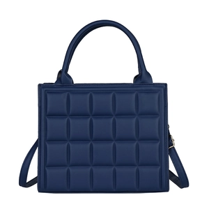 Navy blue quilted square handbag with double top handles and adjustable shoulder strap
