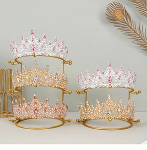 Detailed close-up of golden metal display stands showcasing bridal crowns and headpieces
