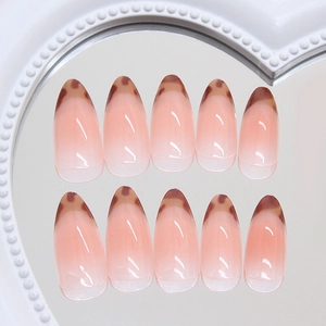 Faux ongles amande imprimé léopard français avec dégradé rose et pointes écaille de tortue