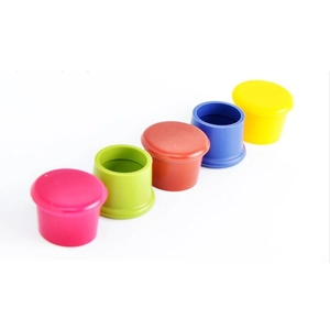 Set of five colorful food-grade silicone bottle caps in pink, green, red, blue, and yellow