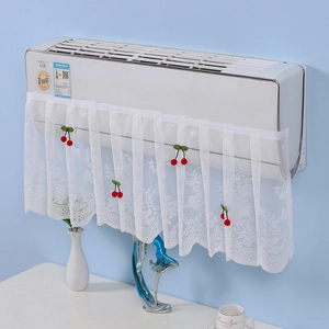 Detailed lace texture of white air conditioner cover featuring red cherry decor